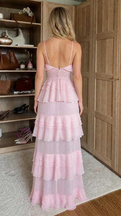 Back view of model wearing pink ruffled tiered maxi dress