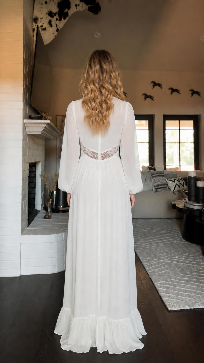 Back view of woman in white maxi dress