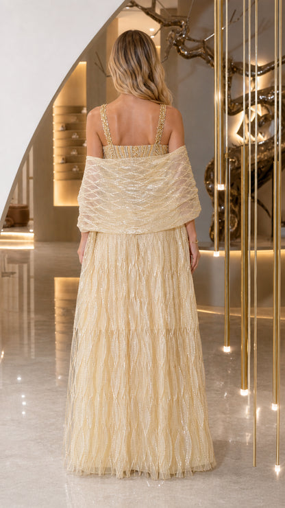 Back view of champagne formal gown showing back straps and shawl