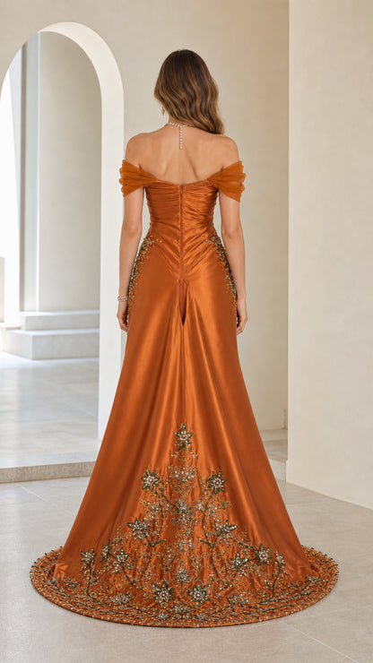 Back view showcasing detailed embroidery on the train of rust orange gown