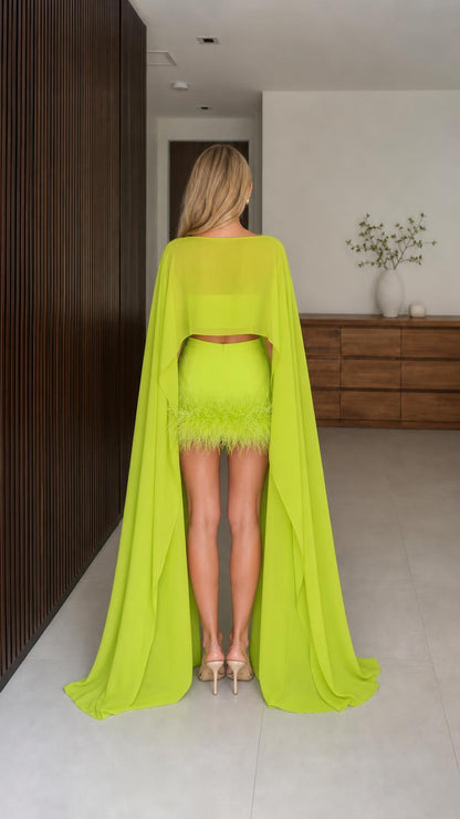 Back view showing long cape draping