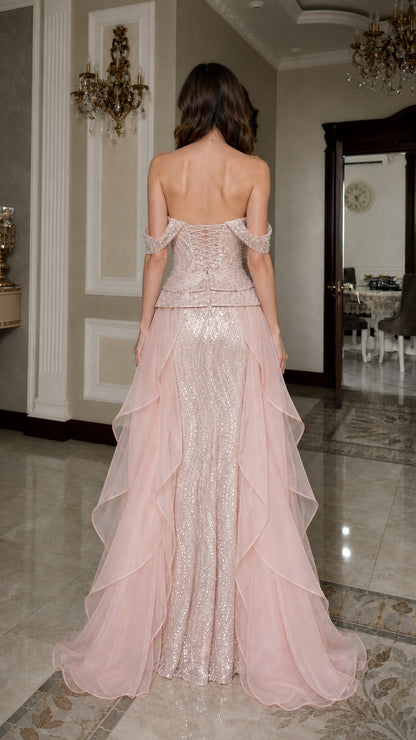 Back view of pink formal gown showing corset-style detailing