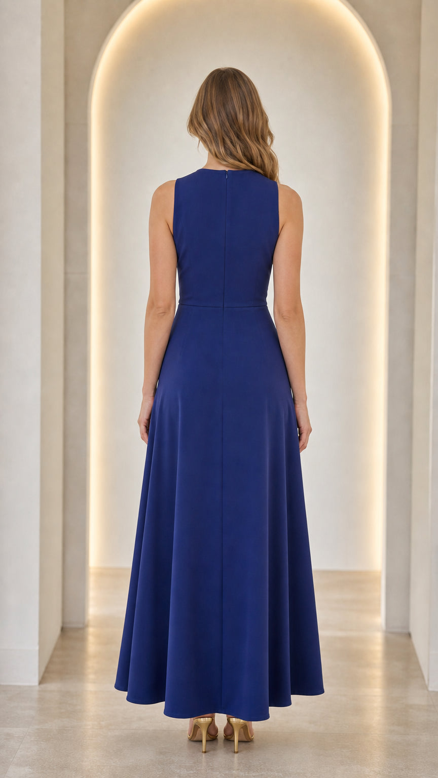 Back view of woman wearing a blue one-shoulder maxi dress