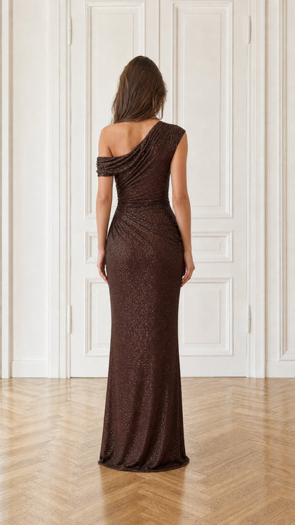 Back view of model showcasing draped back detail of brown dress