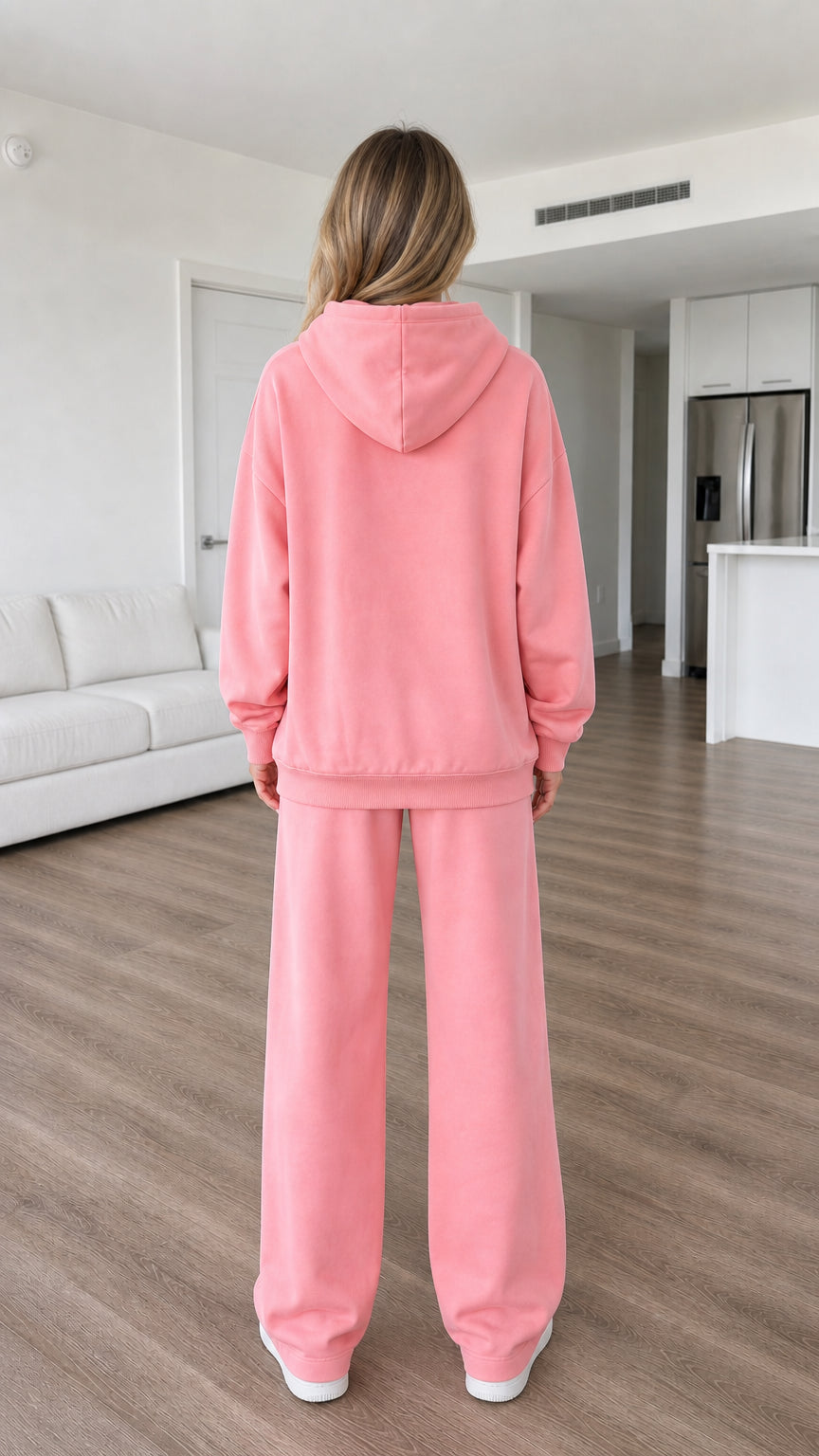 Back view of model in pink matching tracksuit set