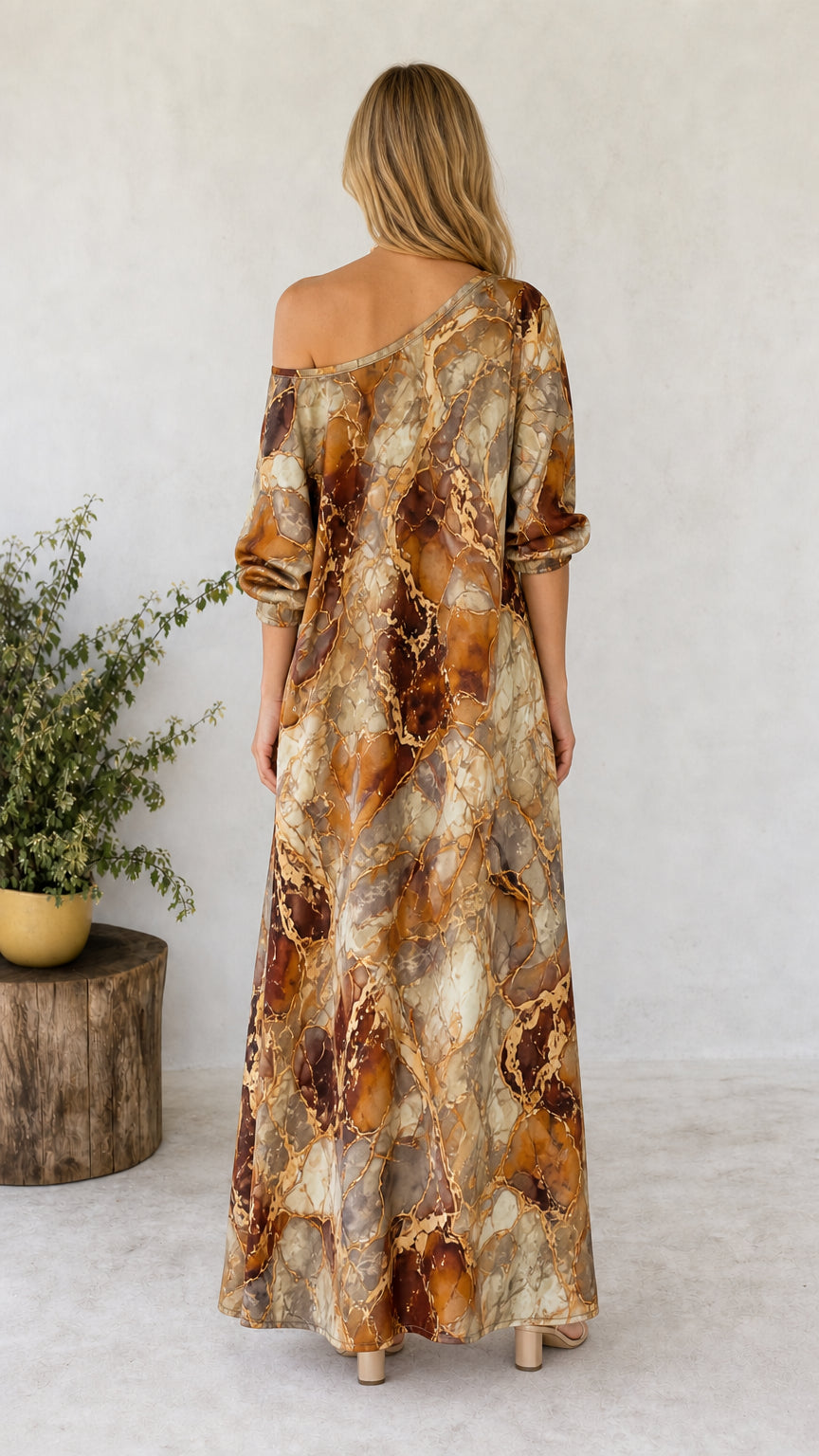 Back view of model wearing brown marble print off-shoulder maxi tunic