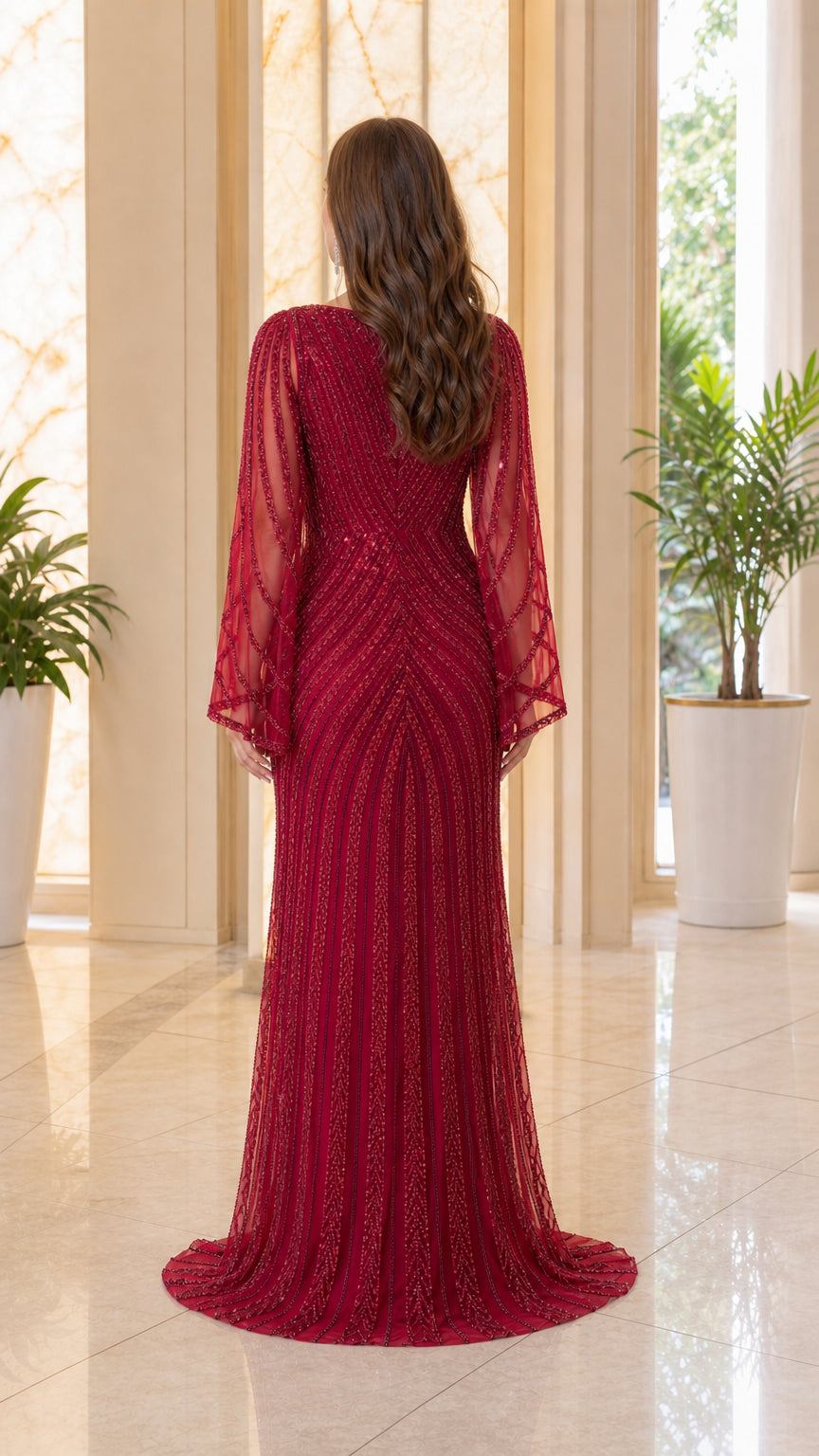 Back view of burgundy sequin beaded long sleeve formal gown