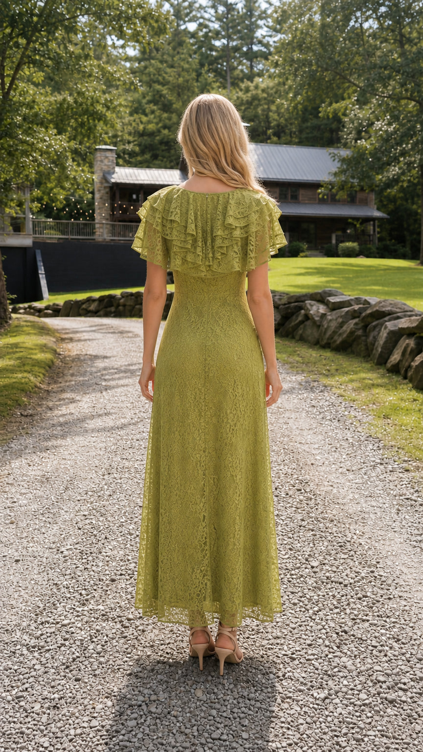 Back view of model showing the back ruffle capelet and maxi length of the olive lace dress