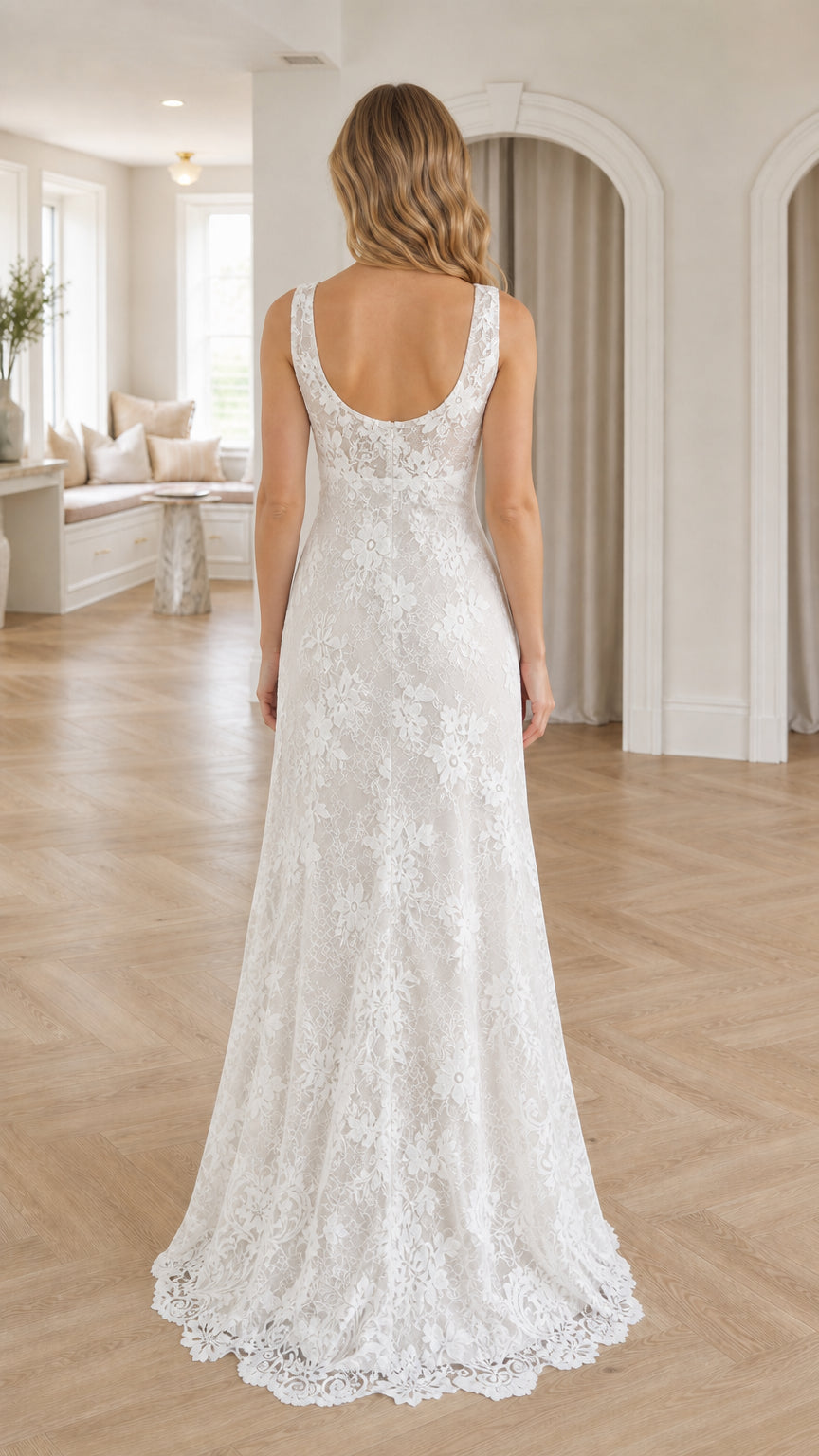 Back view of model showcasing scoop back and lace train of white dress