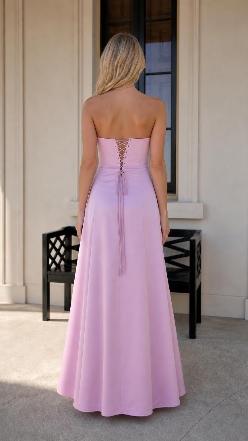 Back view highlighting lace-up back detail of pink maxi dress