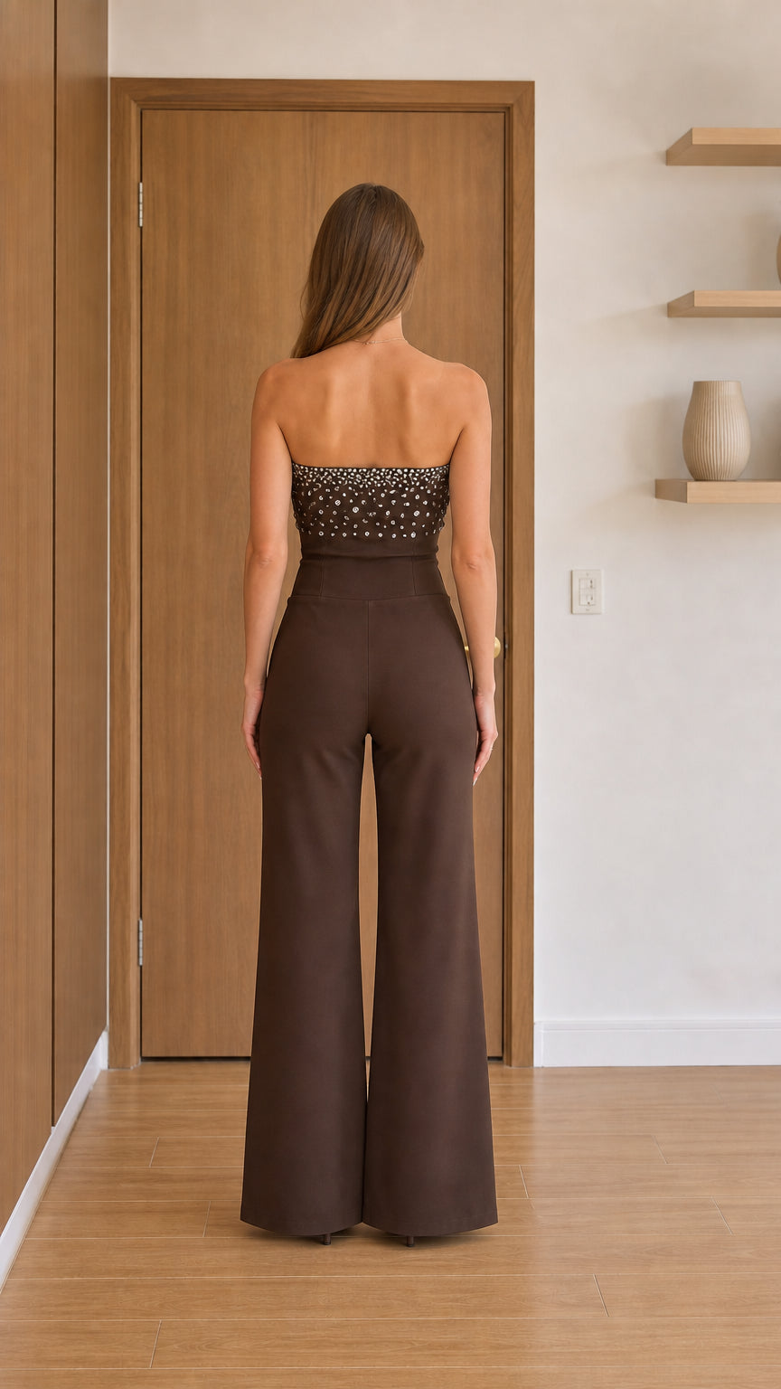 Back view of model in brown crystal embellished jumpsuit
