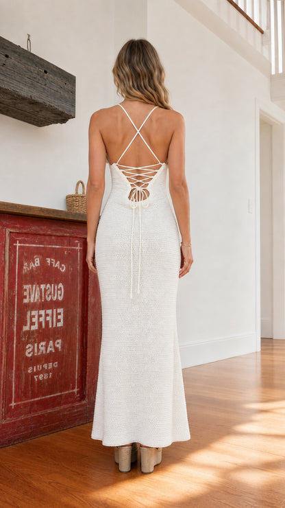 Back view highlighting the lace-up back detail on the white dress