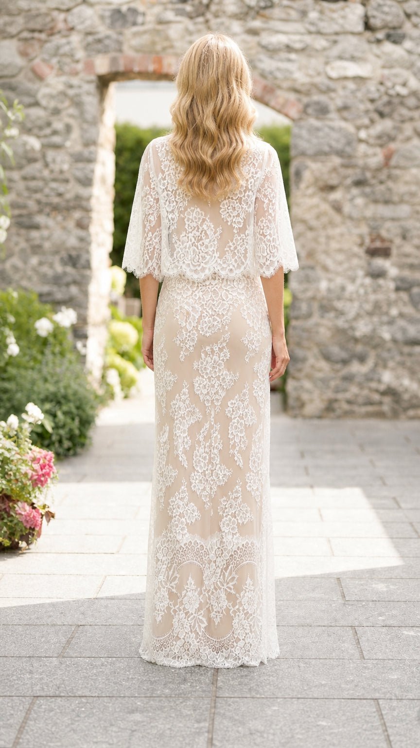 Back view of woman in white lace maxi skirt set