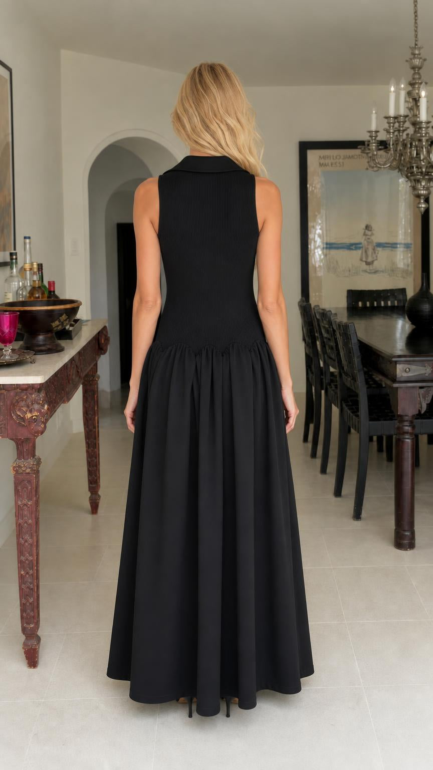 Back view of woman in black sleeveless maxi dress