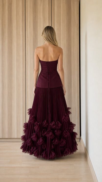 Back view showcasing corset lace-up detail on burgundy evening gown
