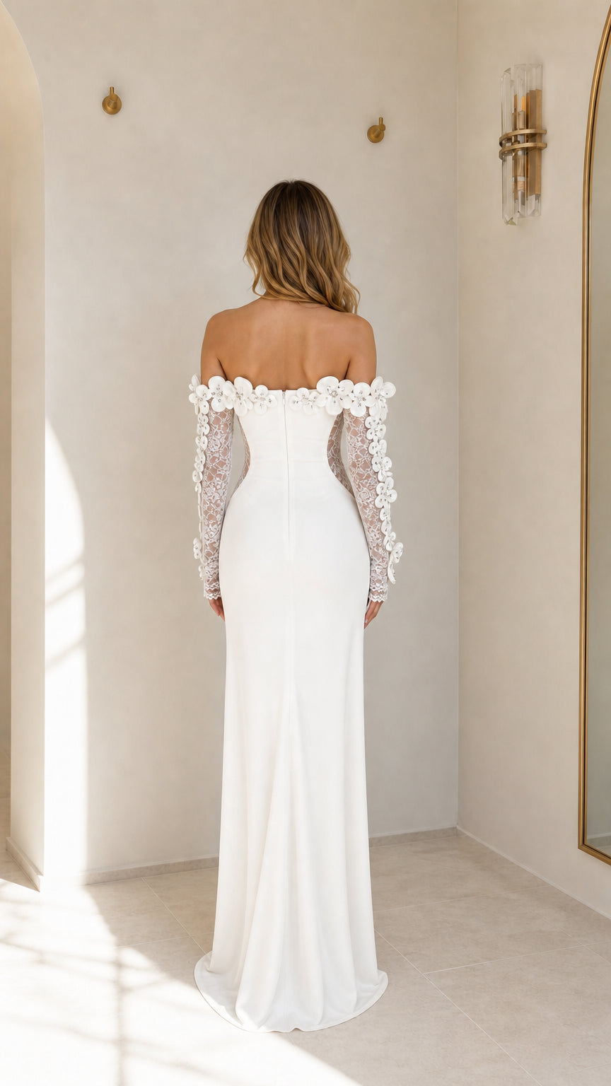 Back view of white evening dress with sweep train