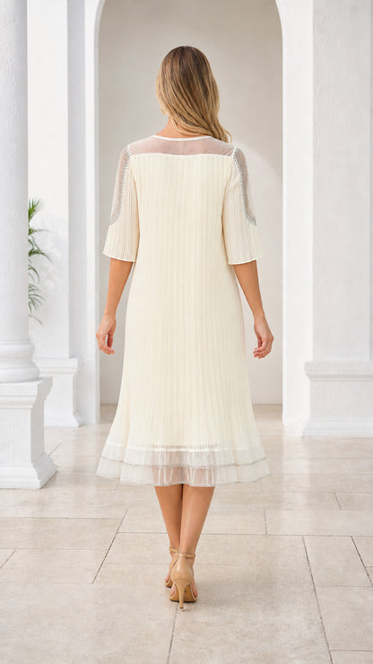 Back view of cream pleated midi dress showing flowing silhouette and hem