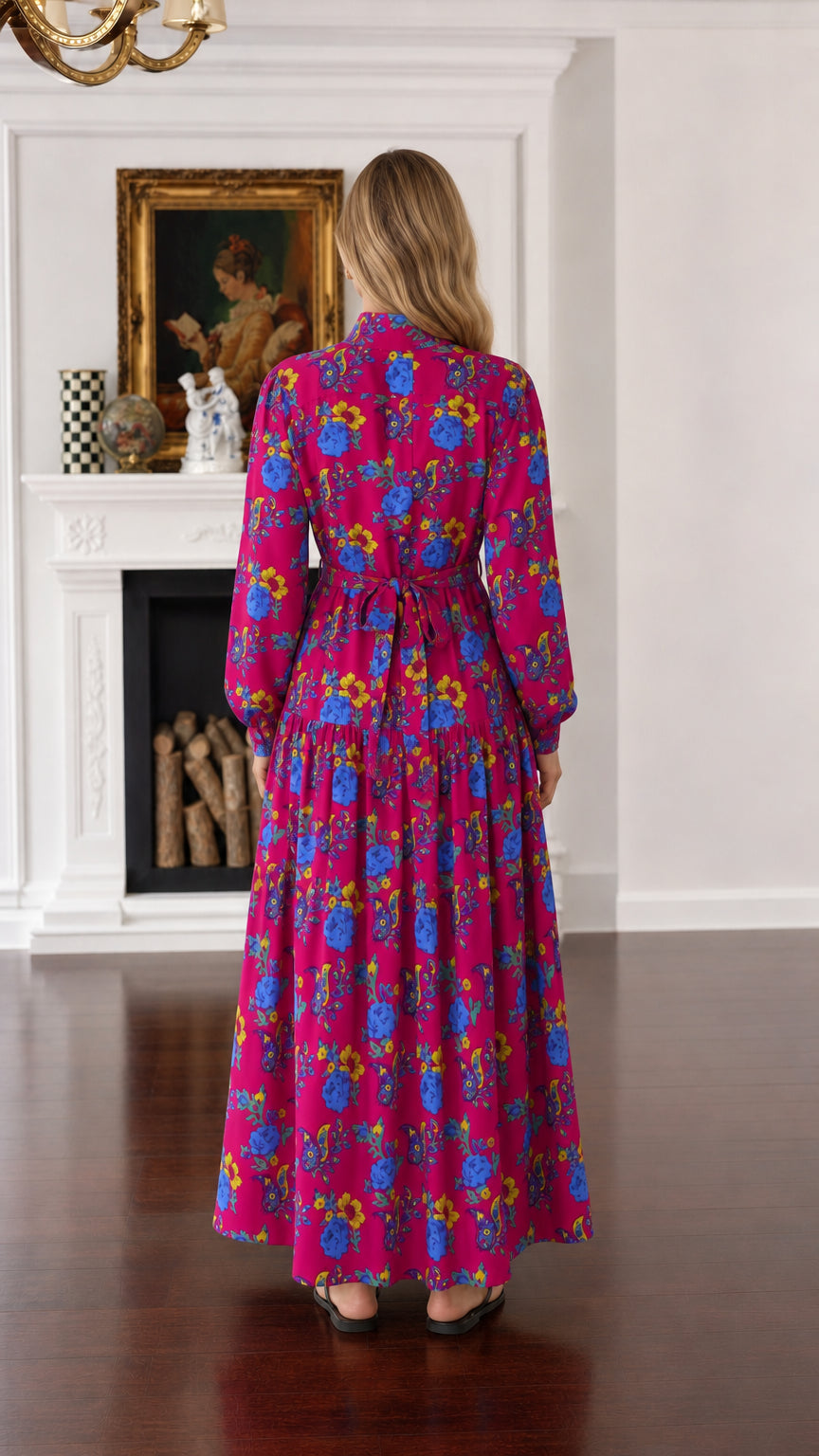 Back view of woman wearing fuchsia floral long-sleeve maxi dress