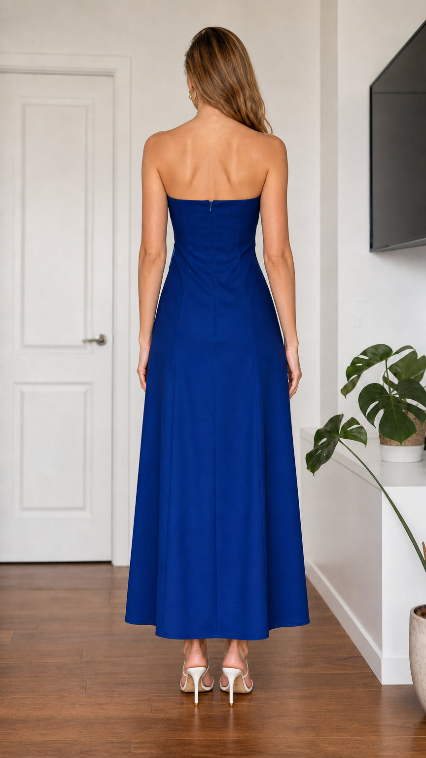 Back view of model in royal blue strapless maxi dress