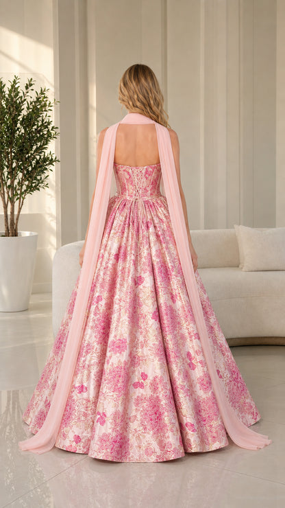 Back view showing the bodice closure and sweeping skirt of the pink gown
