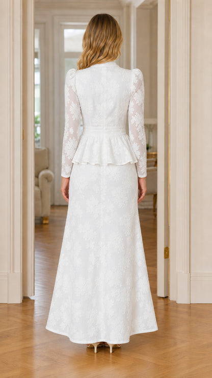Back view of woman wearing white textured floral peplum maxi dress