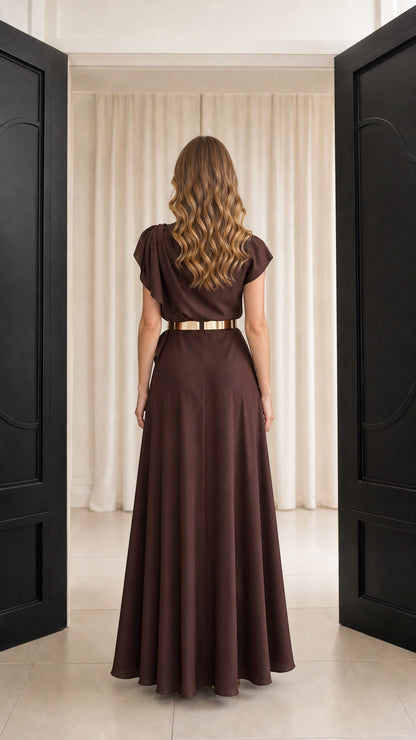 Back view of chocolate brown asymmetric draped floor-length gown