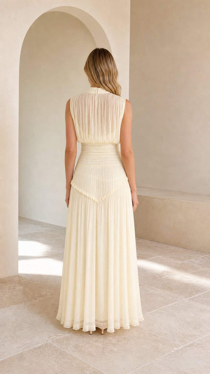 Back view of model in cream high-neck chiffon formal maxi dress