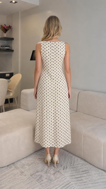Back view of cream polka dot midi dress