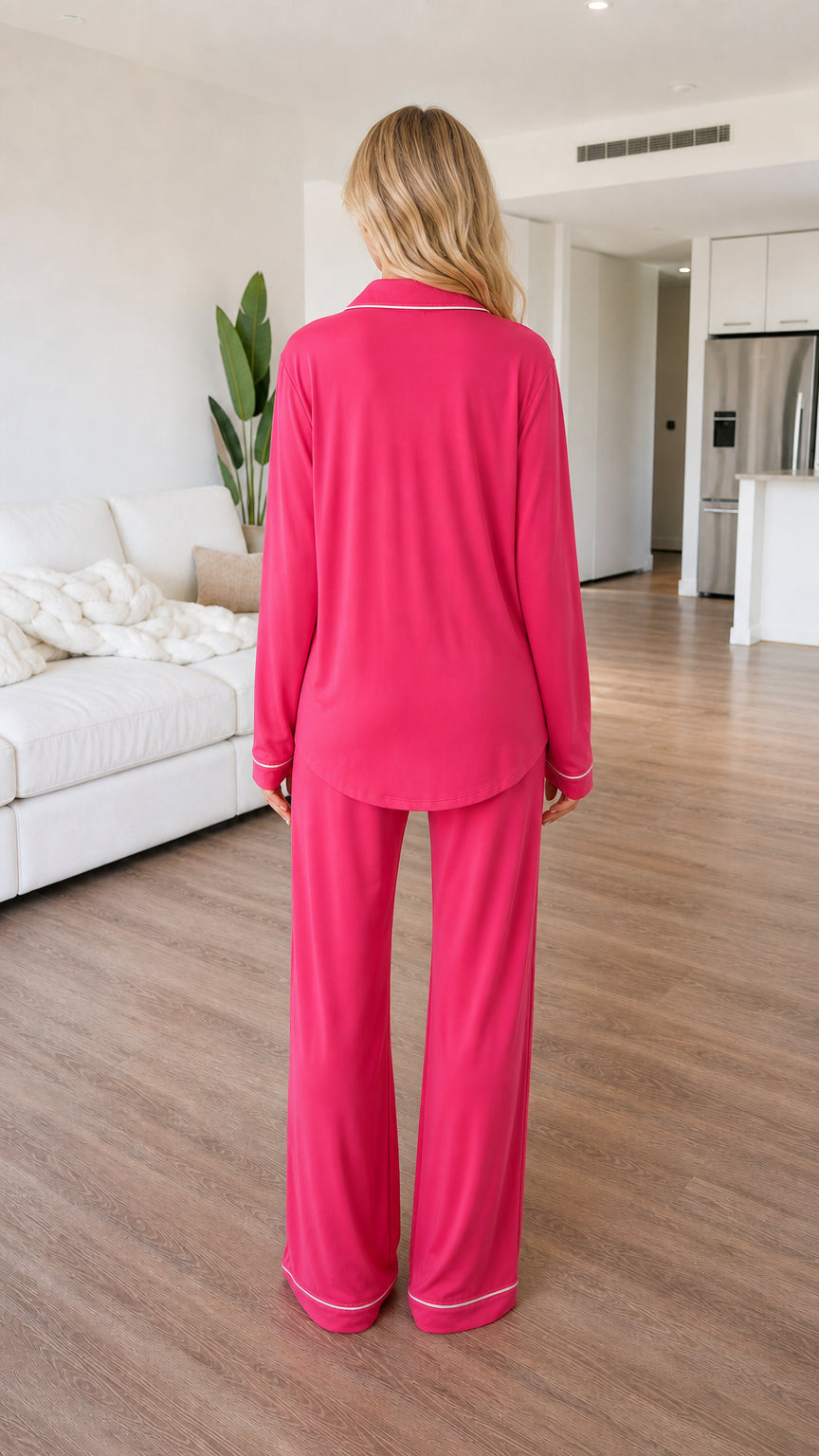 Back view of model showcasing the fluid drape of the hot pink long sleeve pajama set