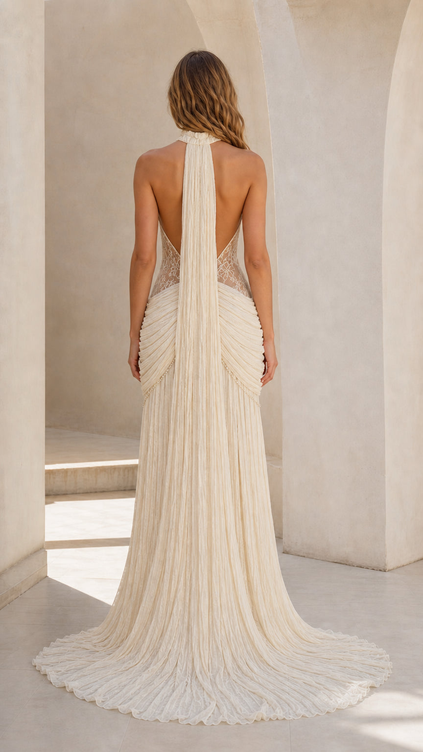 Back view showing open back design of ivory gown