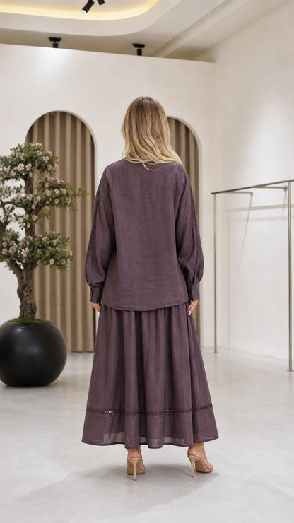 Back view of the mauve blouse and flowing maxi skirt set