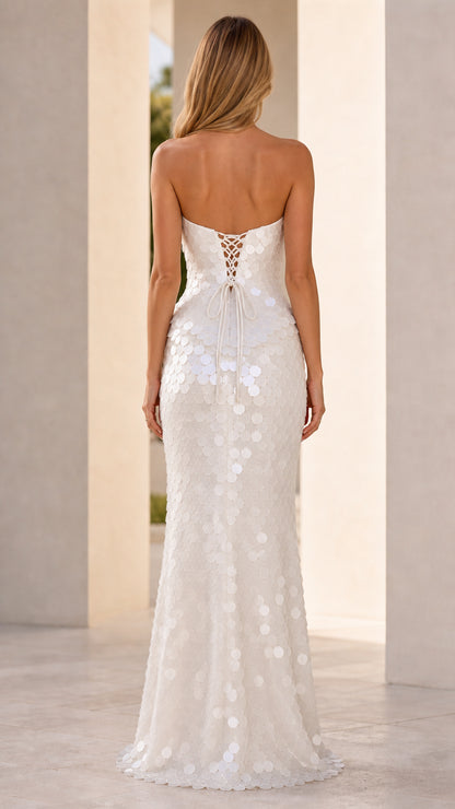 Back view showcasing lace-up corset detail on white sequin dress