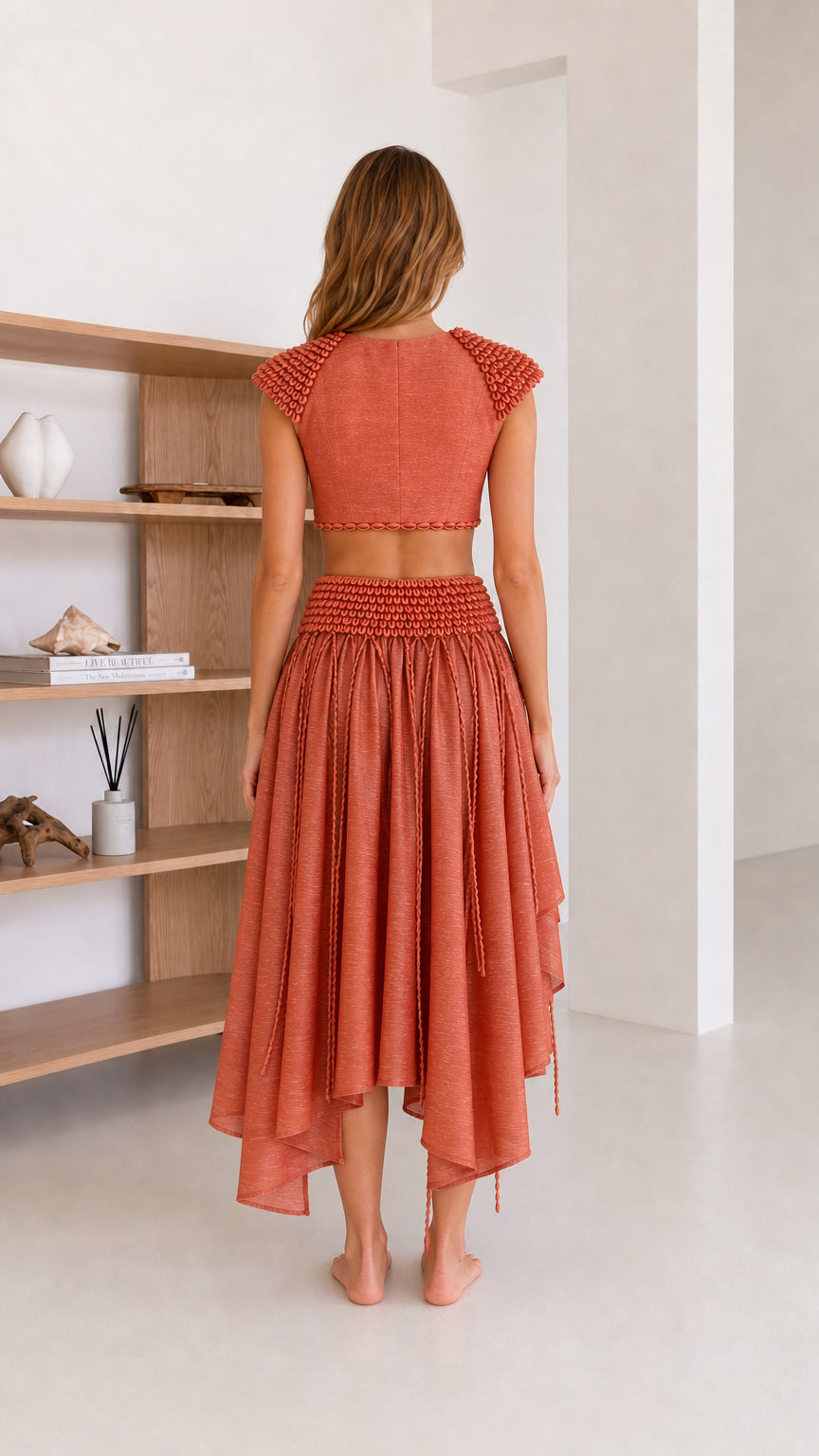 Back view of rust coordinating crop top and skirt set