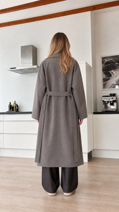 Model wearing grey maxi coat back view with tied belt