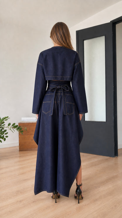 Model wearing indigo blue set, back view with tied waist detail
