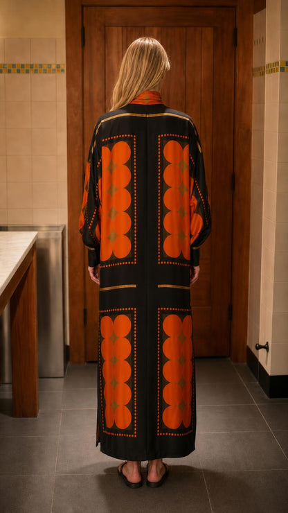 Back view of model showcasing back pattern on black maxi dress