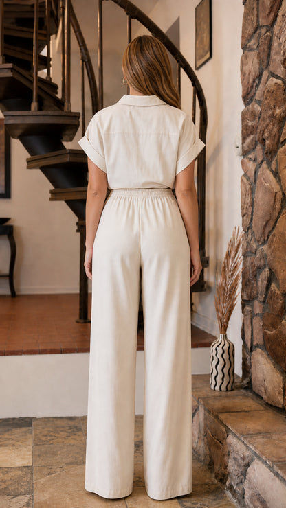Back view of woman wearing beige two-piece outfit