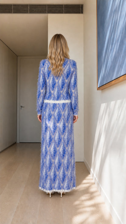 Back view of model in blue textured knit dress