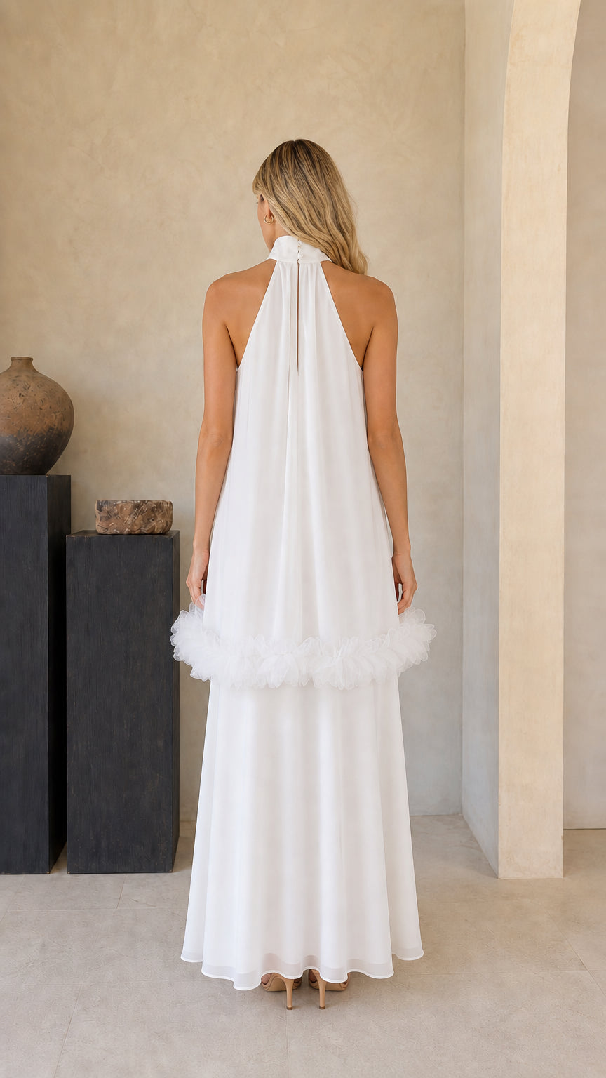 Back view of model showing back collar and pleated drape on white maxi dress