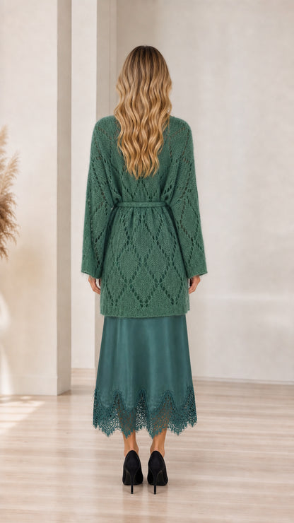 Model wearing green cardigan, back view