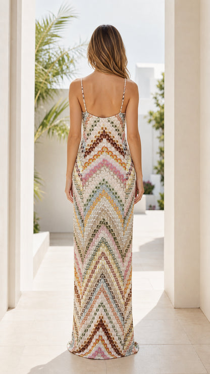 Model wearing beige multi-color chevron knit maxi dress, back view