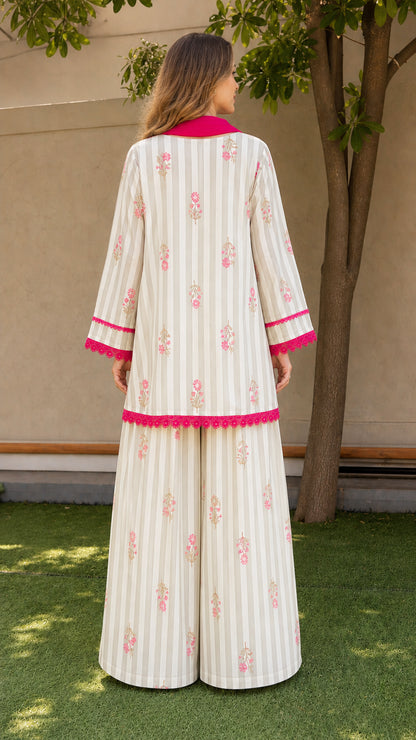 Back view of woman wearing white 3-piece kurti set