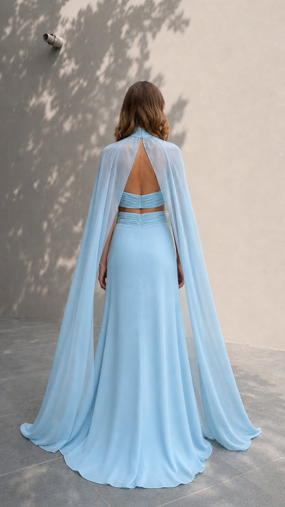 Back view showcasing sheer flowing cape on light blue evening dress