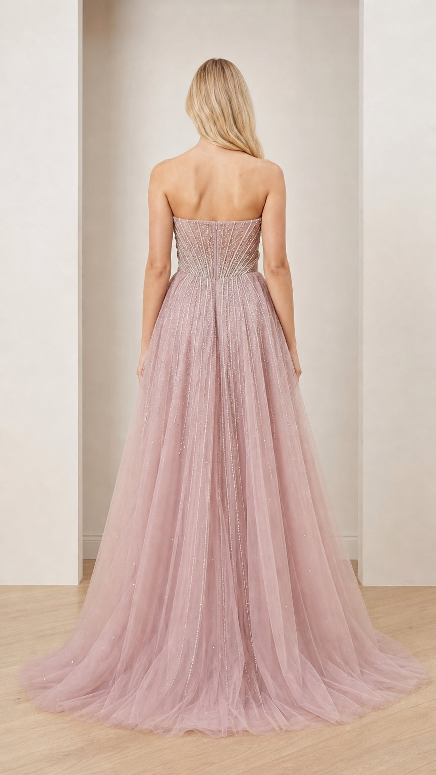 Back view showcasing sweeping train on Dusty Rose tulle gown