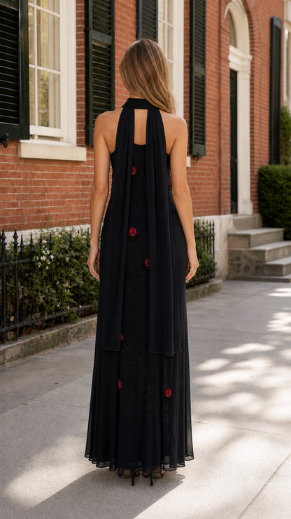 Back view of black halter maxi dress showing draped panels