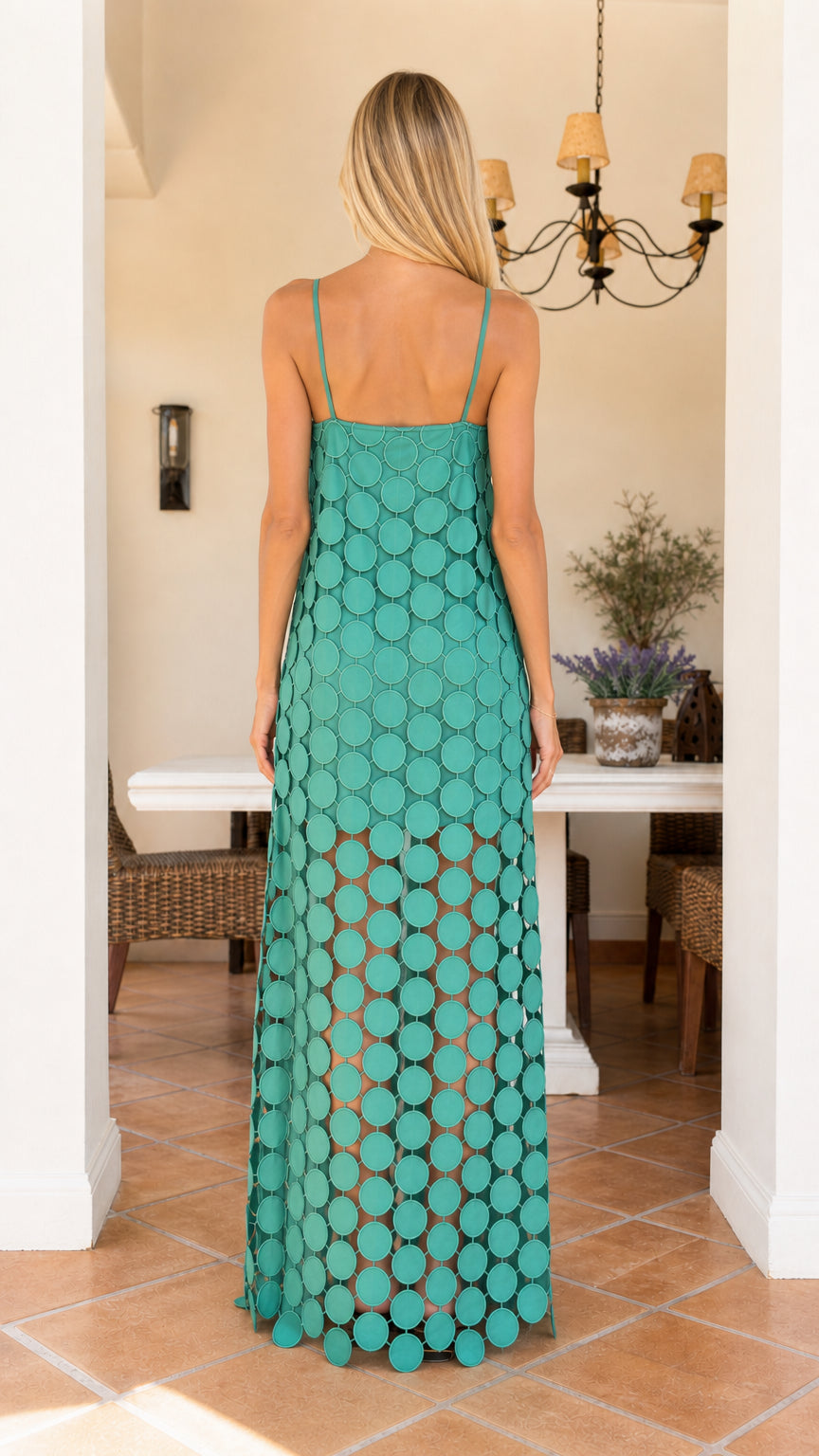 Back view of woman wearing teal cutout circle maxi dress