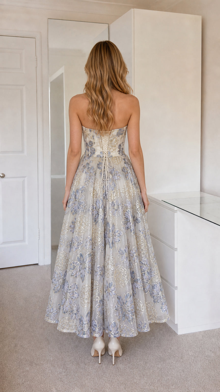 Back view showcasing corset lacing on champagne dress