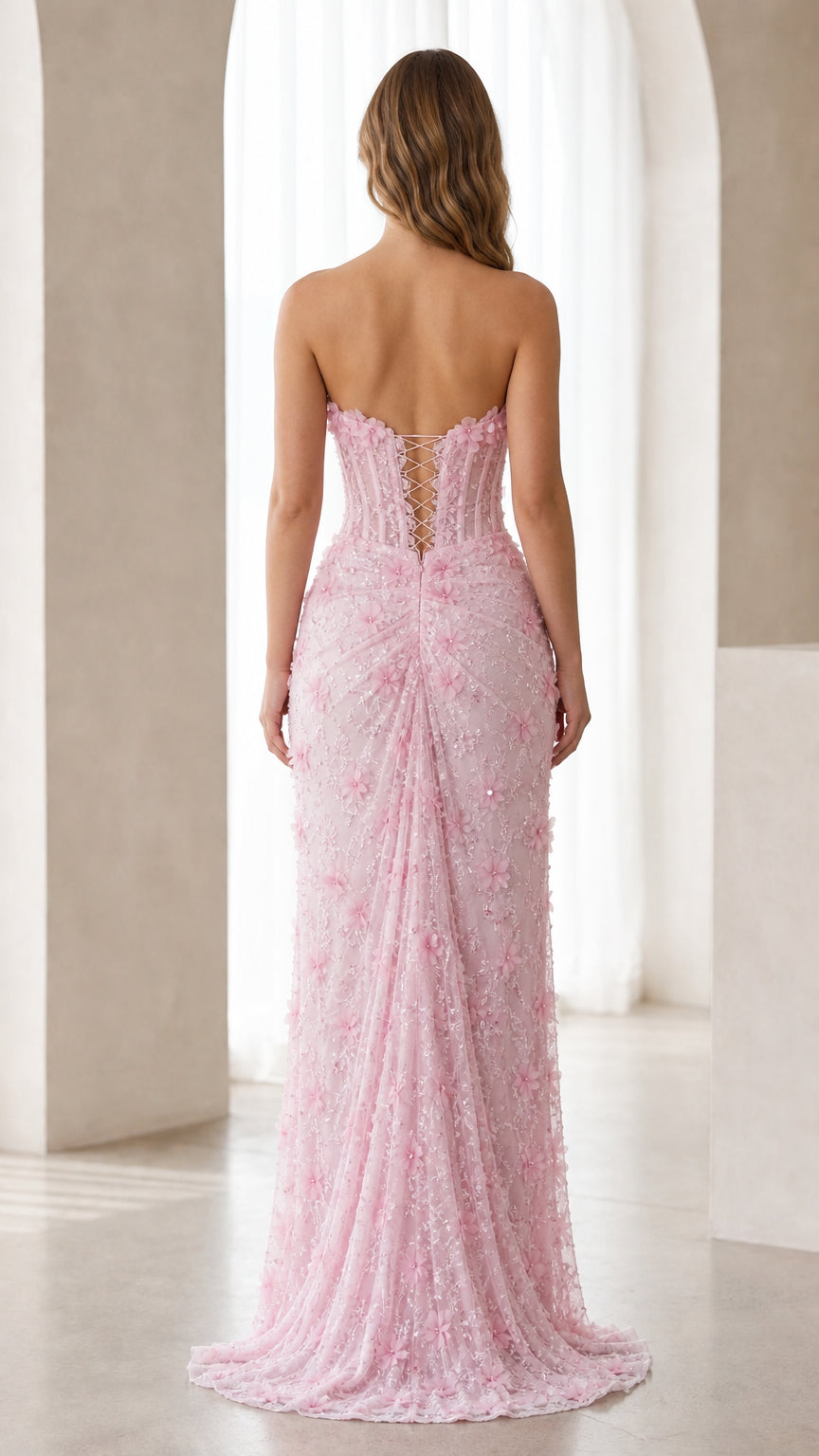 Back view of pink strapless maxi dress with lace-up detail