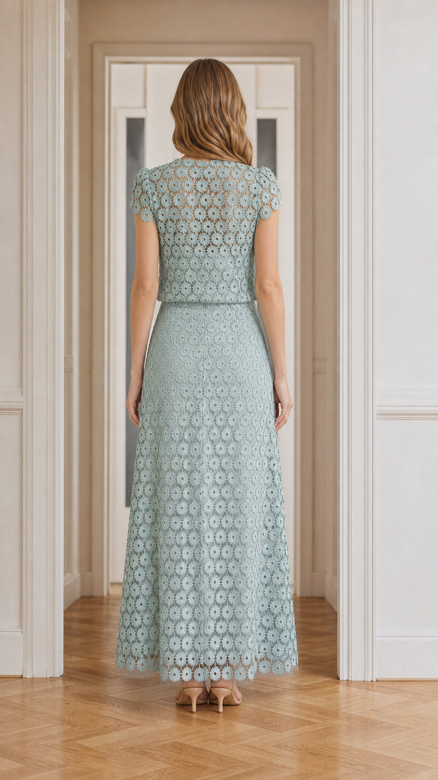 Model wearing sage green floral lace maxi dress, back view