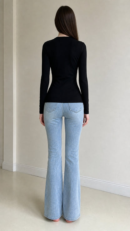 Back view of woman wearing black long sleeve top